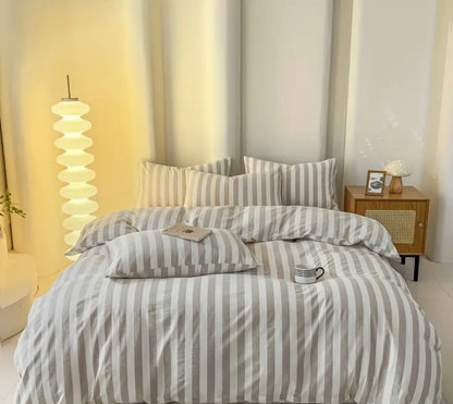 Cotton Quilt Cover Set in a stylish bedroom setting with striped bedding and modern lamp.