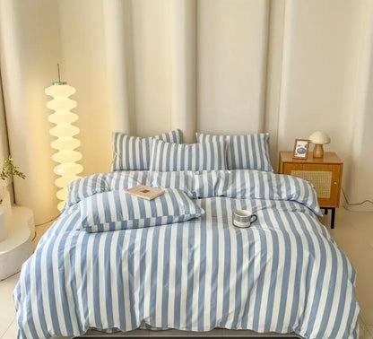 Cotton Quilt Cover Set featuring blue and white stripes on a neatly made bed with decorative pillows.