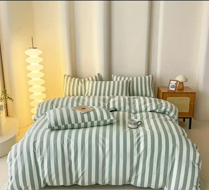 Cotton Quilt Cover Set featuring green and white stripes with matching pillows in a modern bedroom setting.