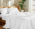 100 Percent Washed Cotton Sheet Set displayed on a neatly made bed with natural light and greenery.
