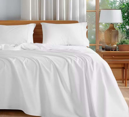 100 Percent Washed Cotton Sheet Set on a cozy bed with white bedding and natural light from windows.
