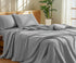 100 Percent Washed Cotton Sheet Set displayed on a neatly made bed in a cozy, sunlit room.